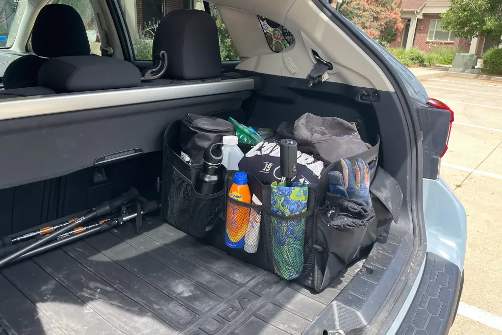 blankets or winter coats, freeing up considerable space. Hanging organizers that attach to the back of the rear seats can hold smaller items, keeping them accessible and off the trunk floor.